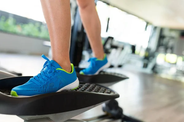 Woman step on Elliptical machine — Stock Photo, Image