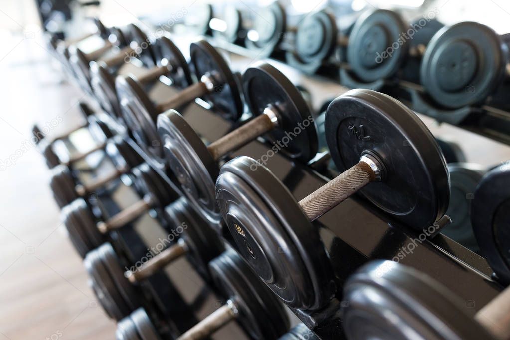 Dumbbell equipment in fitness gym room