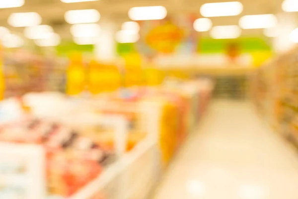 Customer shopping at supermarket store with bokeh light