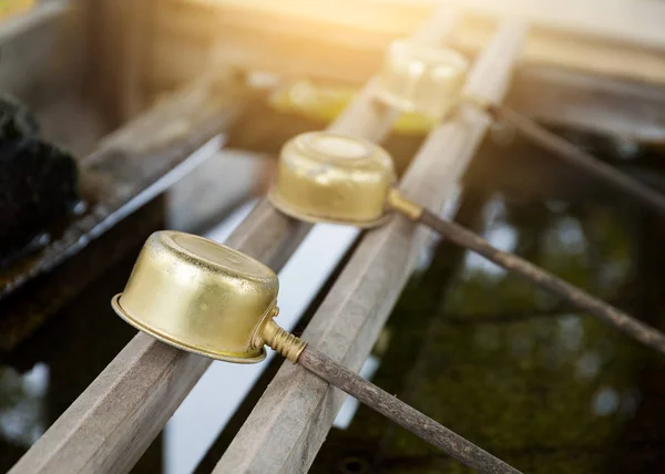 Japanese wooden ladles in shrine — Stock Photo, Image