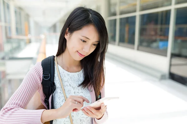 Woman using mobile phone in shopping mall — Stock Photo, Image