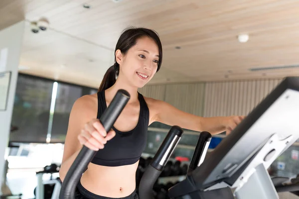 Sport Woman training on Elliptical machine — Stock Photo, Image