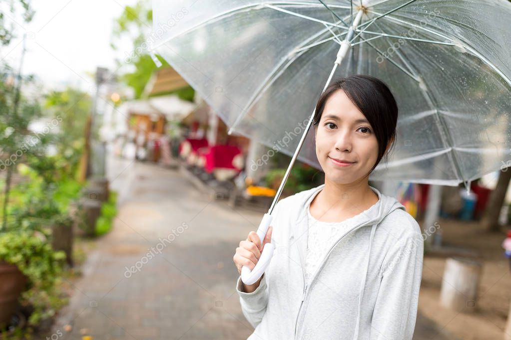 Young woman at outdoor in rainy day