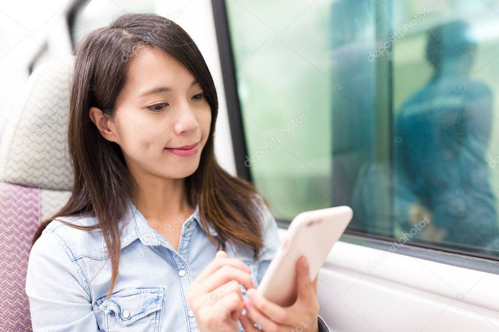Woman using smartphone and travelling