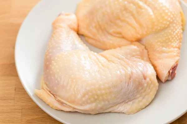 Fresh Raw chicken legs on plate — Stock Photo, Image