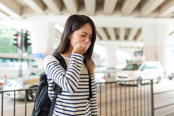 Woman suffer from nose allergy