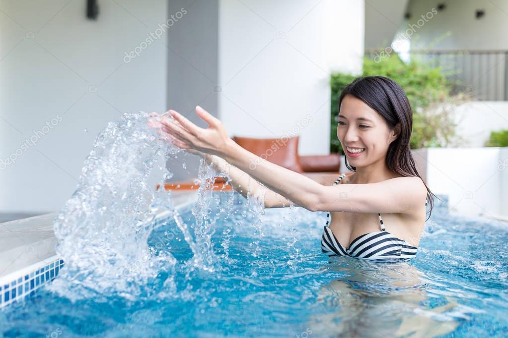 Woman enjoy jacuzzi in resort house