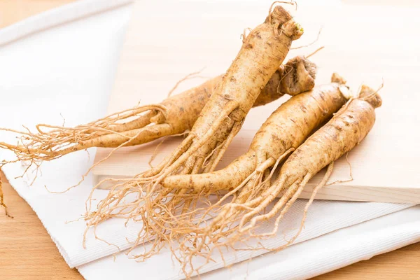 Korean Ginseng over wooden background — Stock Photo, Image