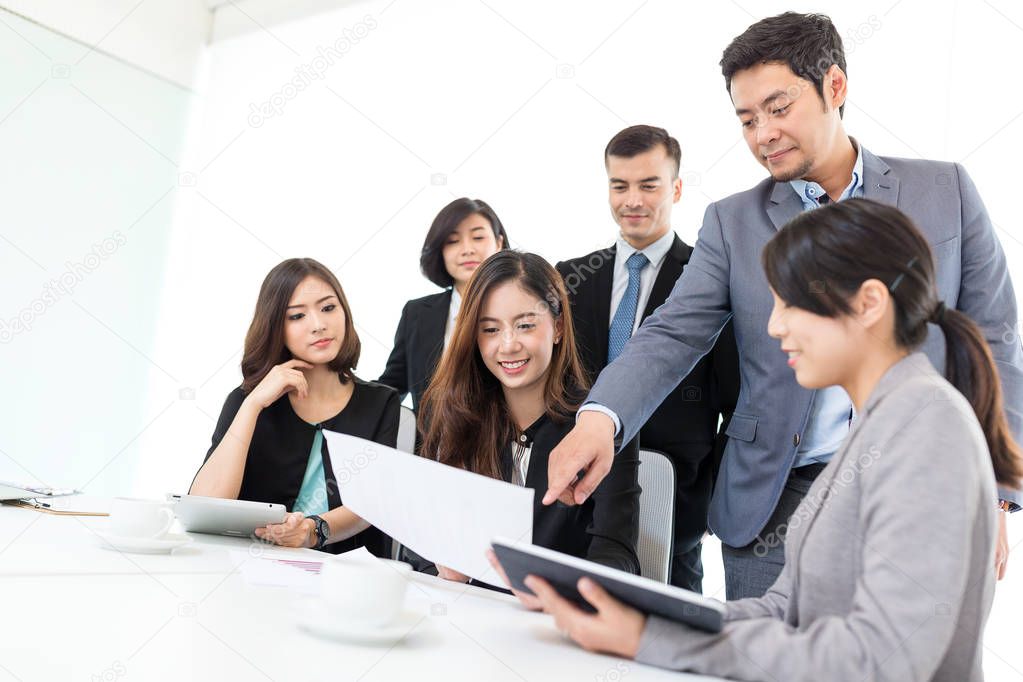 Businesspeople discuss in conference room