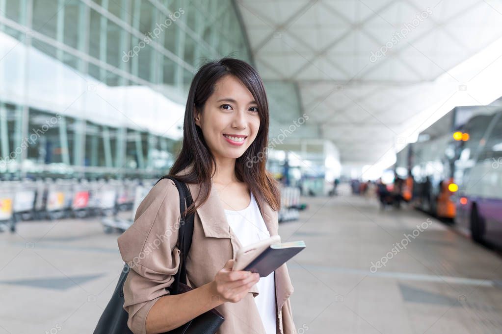 Woman go for a trip with passport at airport