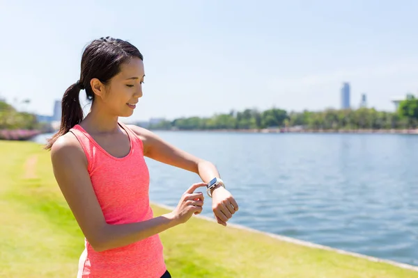 Sport woman using smart watch