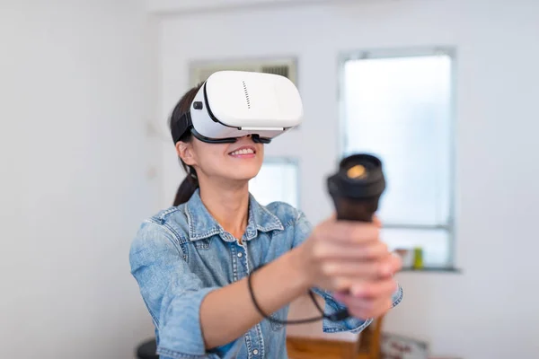 Woman play game with virtual reality device
