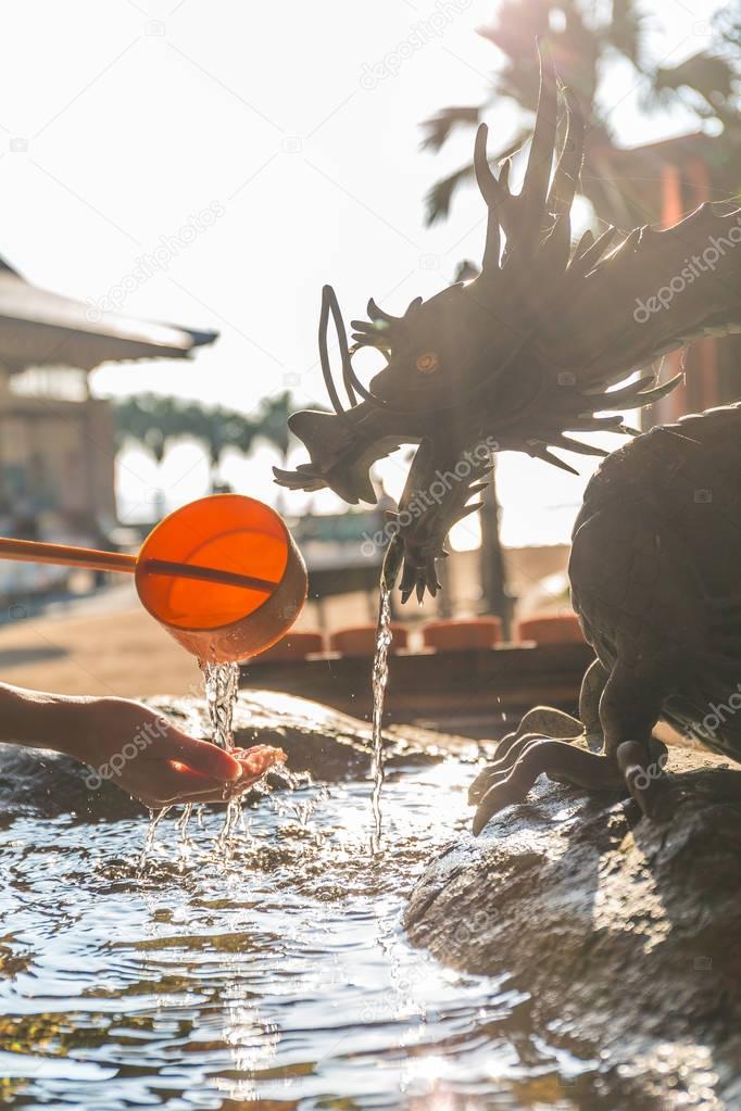 Bamboo water fountain with dragon statue 