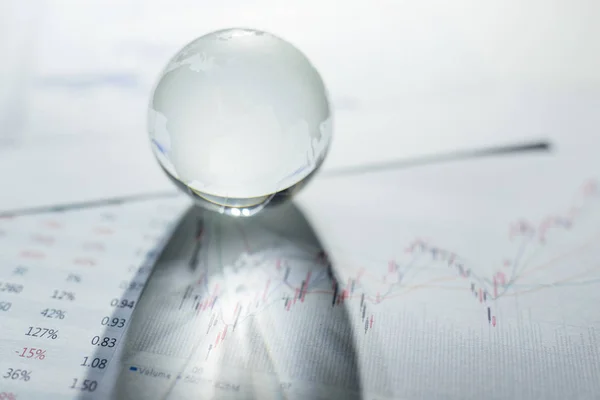 Glass globe on the chart paper — Stock Photo, Image