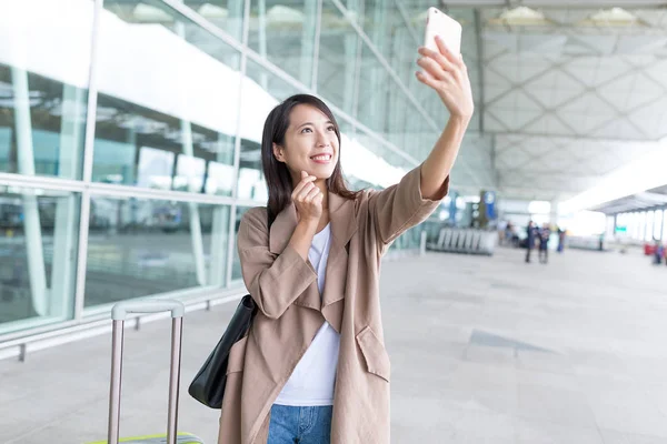 woman go travel and taking selfie