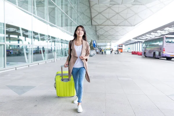 Woman go travel with cellphone and luggage — Stock Photo, Image