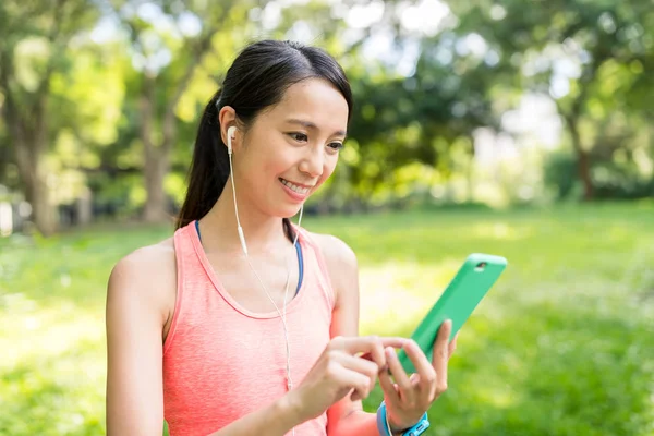 Woman listen to song on cellphone