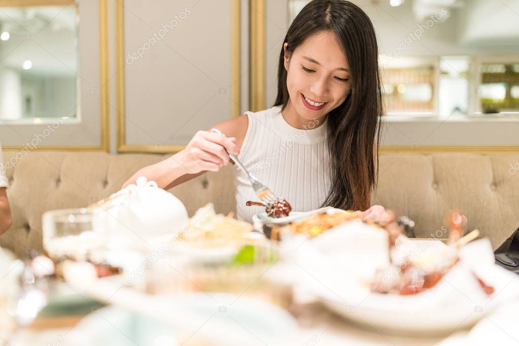 Woman having meal in restaurant