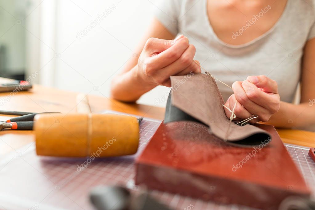 Female making Leather craft