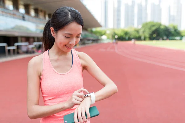 Sport woman using wearable smart watch