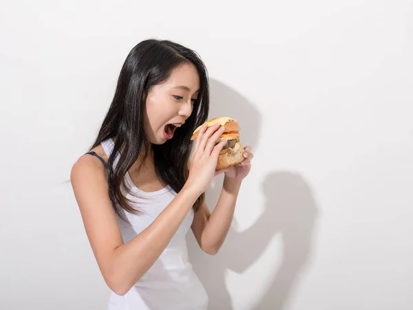 Asian Woman eating burger — Stock Photo, Image