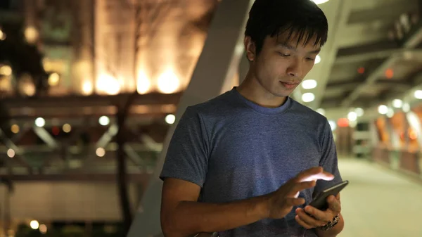 Asian man using mobile phone