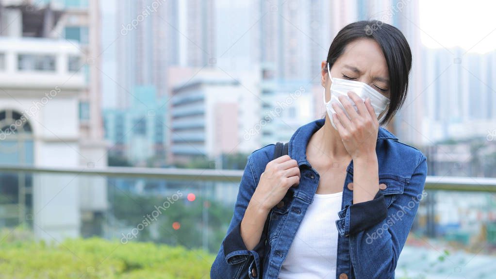 Woman cough at outdoor 