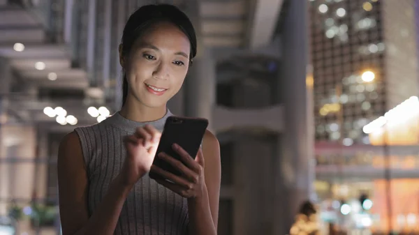 Woman looking at mobile phone