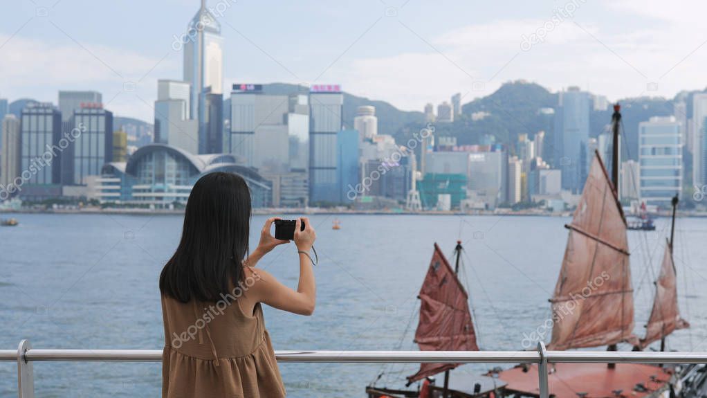 Woman taking photo with cellphone 