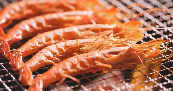 Prawns grilled on barbecue charcoal fire
