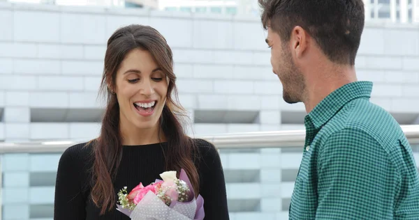 Caucasian Man Giving His Wife Surprise Flower Bouquet — Stock Photo, Image