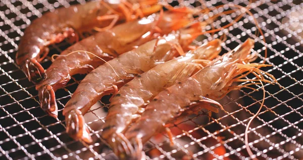 Grilled prawns on the grill close up