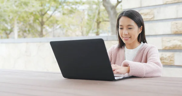 stock image Woman using notebook computer at outdoor 