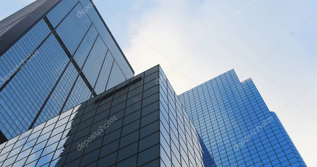 Business office tower with sunny skyline 