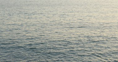 Gün batımı ve deniz dalgaları görüntüleme