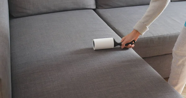 Woman Sticky Roller Cleaning Sofa — Stock Photo, Image