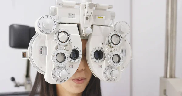 Asian Woman doing eye test