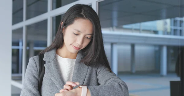 Woman using smart watch at outdoor