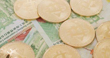 Bitcoins ve Hong Kong banknotlar