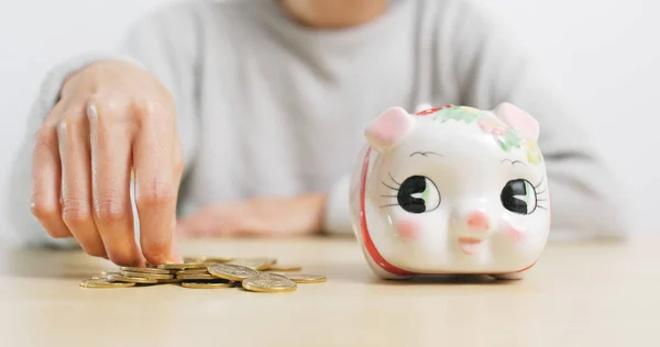 Woman Putting Coins Piggy Bank — Stock Photo, Image