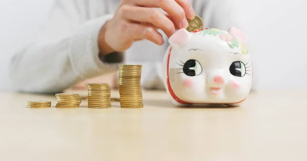 Putting Golden Coins Piggy Bank Home — Stock Photo, Image