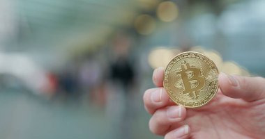 Bitcoin şehirde açık tutan el 