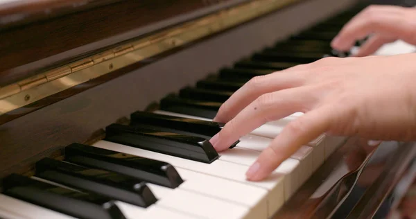 Man playing piano at home