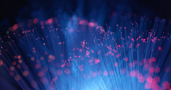 Optical fiber stand over black background  