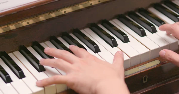 Man playing piano at home