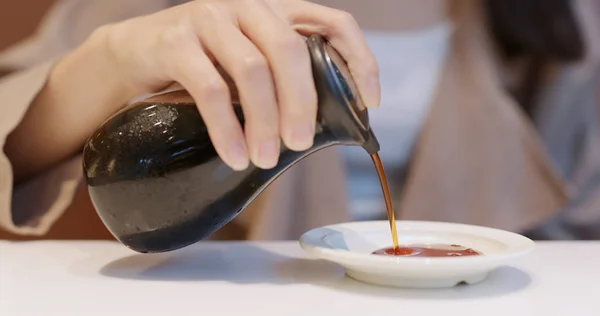 Woman Putting Soy Sauce Plate Japanese Restaurant — Stock Photo, Image