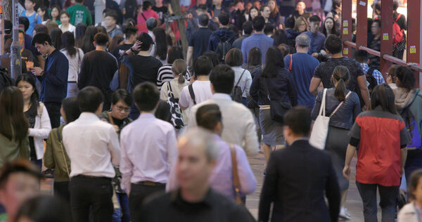Causeway Bay, Hong Kong - 17 March, 2018: People walking in the street at night 