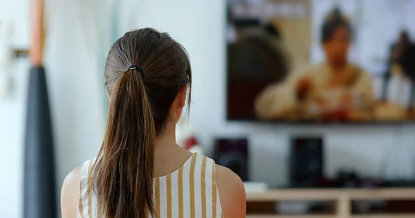 Woman watch tv at home