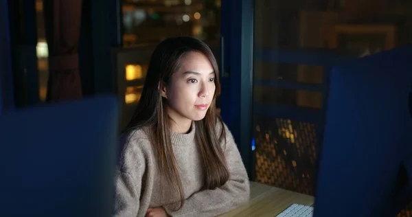 woman work on computer at night