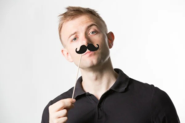 Man wearing fake mustache — Stock fotografie